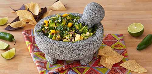 A molcajete filled with guacamole.