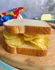 Crisp sandwich on buttered bread with potato chips