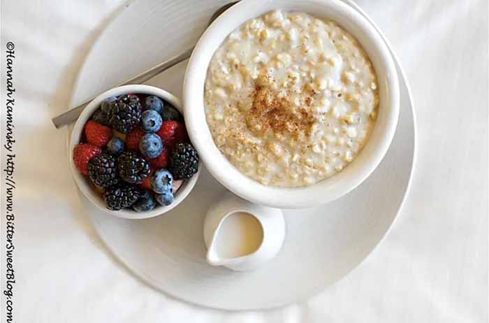 A Bowl Of Oatmeal With Mixed Berries