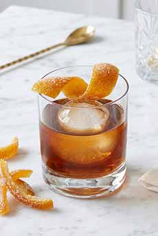 Old Fashioned Cocktail With Candied Orange Peel Twist