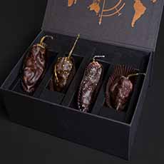 A box of chocolate-covered chili peppers