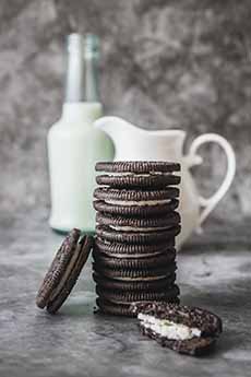 Oreo Cookies Stack With Pitcher Of Milk