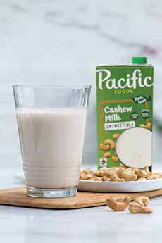 Carton & Glass Of Pacific Foods Cashew Milk