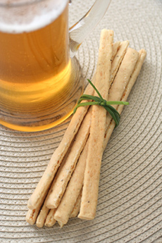 Parmesan breadsticks with a stein of beer
