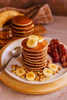 Peanut Butter Pancakes With Sliced Bananas & Bacon