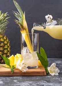 Glass & Bottle of Pineapple Juice