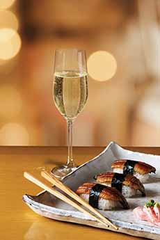 Eel Nigiri Sushi With A Glass Of Prosecco