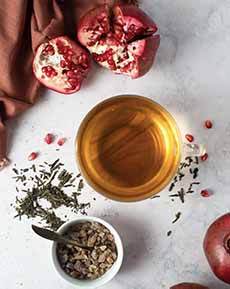 A Glass Mug Of Pomegranate Green Tea
