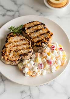 A Plate Of Pork Chops With Heavenly Hash