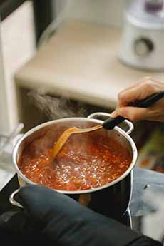 Cooking a pot of Bolognese sauce.