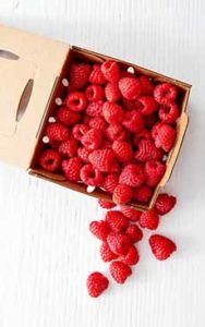 Fresh Raspberries In A Cardboard Box