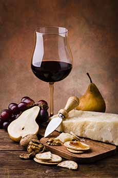 Glass Of Red Wine With Aged Parmigiano-Reggiano Cheese