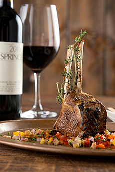 A bottle of Ridge Lytton Springs Zinfandel with rack of lamb.
