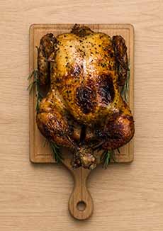Rotisserie Chicken On A Cutting Board
