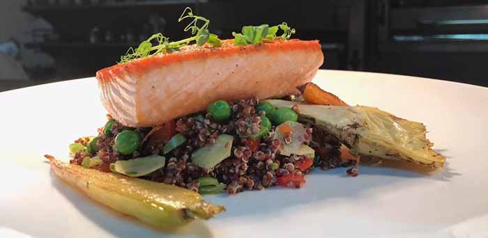 Salmon on a bed of red quinoa
