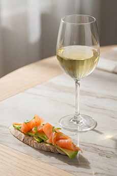Glass Of White Wine With Smoked Salmon Crostini