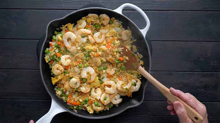 Shrimp fried rice in a skillet.