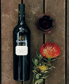 A bottle of Simonsig Pinotage with a glass of the wine.