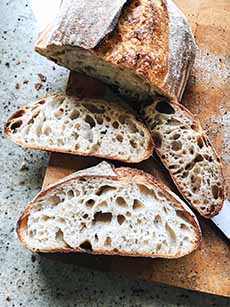 A sliced loaf of sourdough bread.