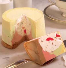 An individual round of Spumoni made up of 4 flavors of ice cream.
