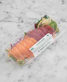 A plastic box of takeout sashimi.