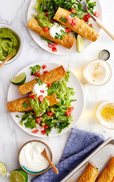 A plate of chicken taquitos