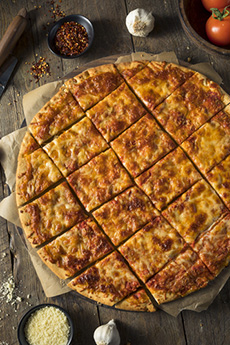 Tavern-style pizza: a round pie cut into square slices