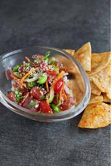 Fusion food: a bowl of poke with a side of tortilla chips.