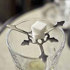 Absinthe Grille Holding Two Sugar Cubes