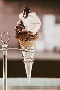 Chocolate & Vanilla Ice Cream Cone In A Metal Stand