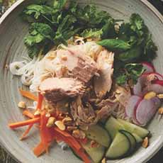 A plate of Vietnamese Rice Noodle Salad, topped with chunks of tuna.