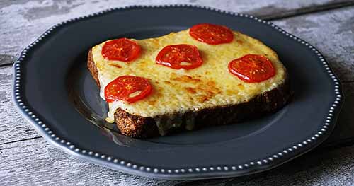 Welsh Rarebit Topped With Sliced Tomatoes