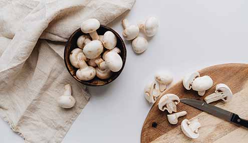 A Bowl Of White Button Mushrooms