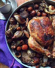 A pan of roast chicken and vegetables